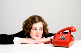 woman waiting by the phone